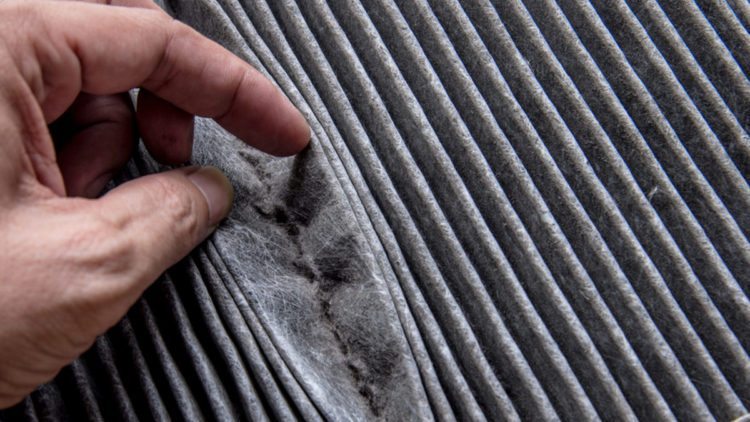 Photo depicting a very dirty furnace filter