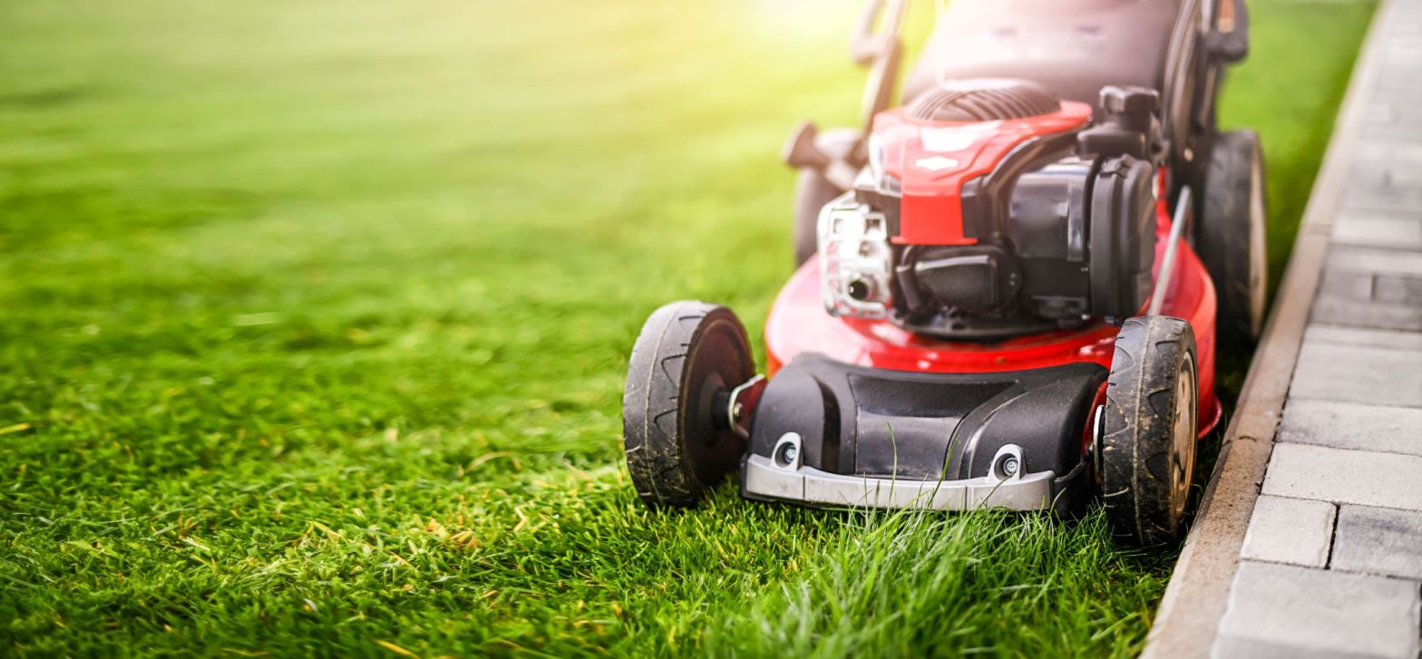 a lawn mower mowing a yard