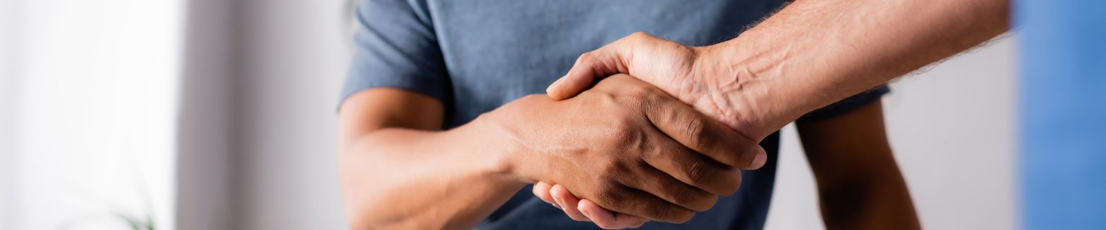 two persons shaking hands